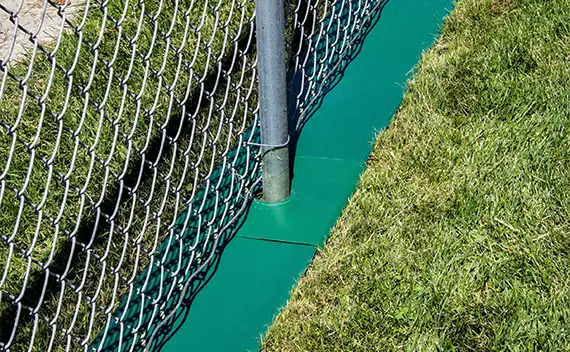 How to Keep Grass from Growing under Chain Link Fence